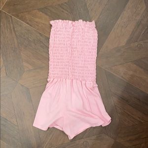 Girls pink smocked romper.